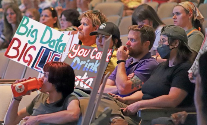 Protest signs,
          Socorro, NM, and they are stopping an AI Data Center
